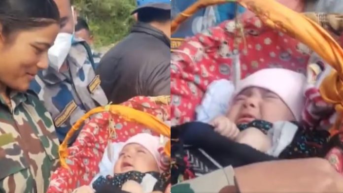One-and-a-half-month-old baby rescued-from-flood-affected
